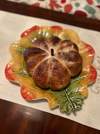 A place setting with pumpkin sourdough.