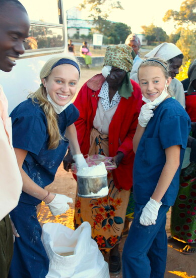 Dr. Tessa helps feed patients, some who walked for days to the clinic.