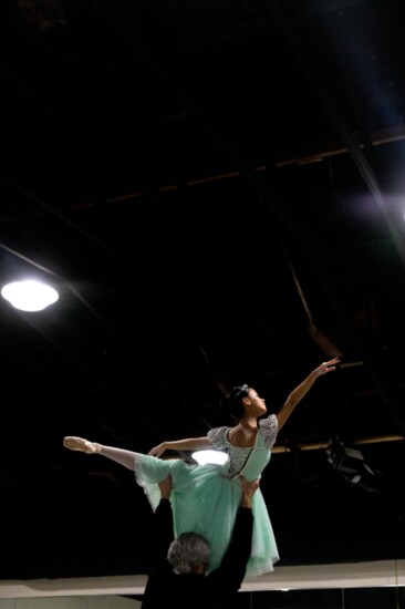 Matthew Reinschmidt holds up Sophia Nguyen, playing Clara