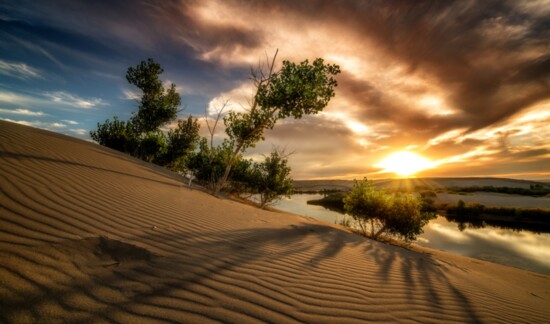Bruneau Dunes State Park. Dramatic sunset with long shadows cast across the sand. PC: Charles Knowles