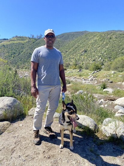 Ron on a hike with his dog Stella.