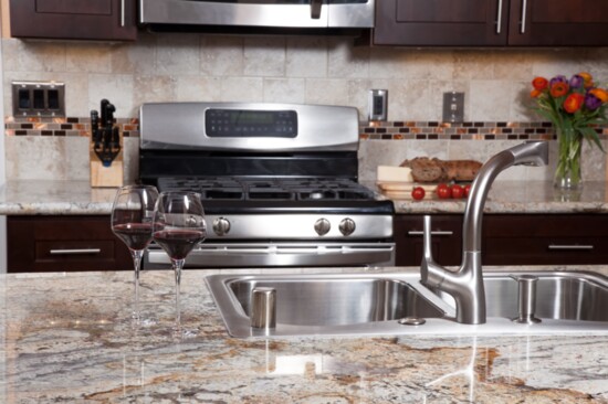 Move over black and gray. Kitchen countertops are leaning to a warmer hue.