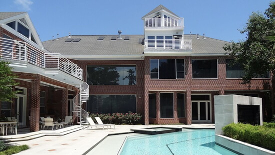 The rear of the 4 story house designed to let in maximum light and views of the gold course. The diamond design from the interior is carried to the exterior.