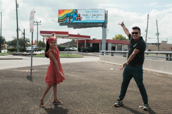 Surprise unveiling of the billboard featuring Melinda's art. Photo Credit: Meg Ruffing. 