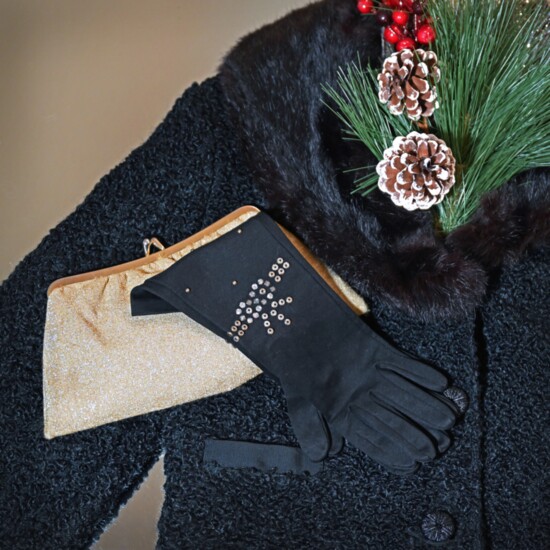 Designer elegantly cropped black boucle button down coat with fur collar ($99). Gold purse ($12.95), metal stud embellished gloves ($24). Max & Ollie's