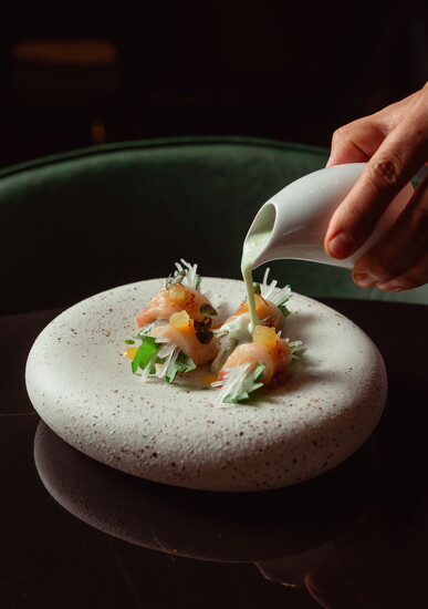 Tableside cocktails and shareable bites invite guests to settle in as music and mood evolve.