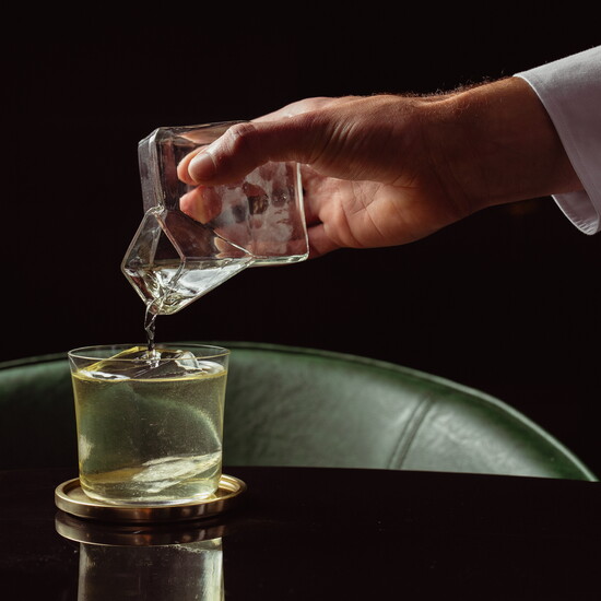 Moon’s intimate bar glows with shifting light, greenery, marble, and cocktails designed for lingering evenings.