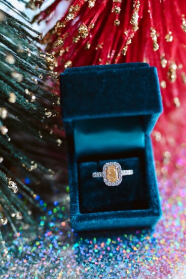 Give bold with this 14-karat white gold fancy yellow diamond halo ring featuring a 1.5-karat cushion cut fancy yellow diamond with a 0.5-karat diamond halo.