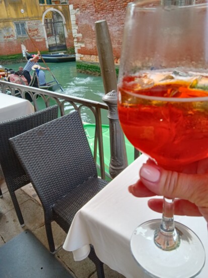 Aperol Spritz while watching the Gondolas in Venice!