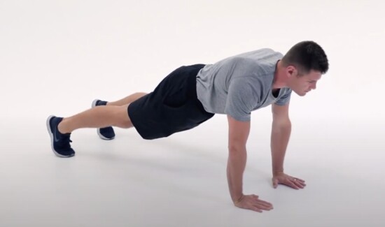 When performing pushups, extend your legs back so you are balanced on your hands and toes, feet hip-width apart. Contract your abs and tighten your core.