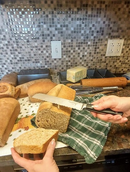 Agi recommends using a knife with a serrated edge to slice the bread on its side. (PHOTOGRAPHY LINDSEY DAVIES)