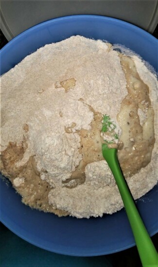 Great breads start with great dough. At left, the dough after the liquid is poured into the "well." At right, the bread after the Tupperware seal "pops." PHOTOG