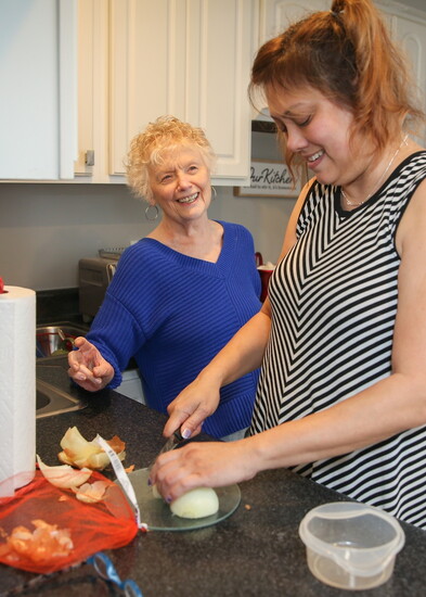Home health aide Lorinda helps Donna with meal preparation as part of the Warren County Elderly Services Program. 