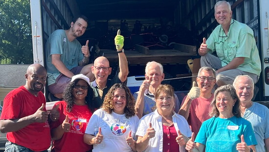 All smiles and thumbs up; the My Global Blessings crew making a difference together.