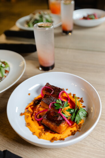 Pork Belly Smokey Romesco with Pickled Shallot and Chorizo Crumble