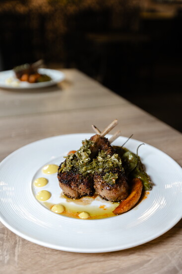 Neon Fig Lamb Chops Smoke Chimichurri with Saffron Aioli and Blistered Shishito Peppers