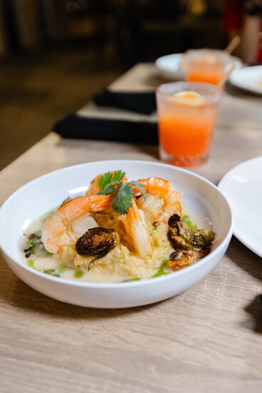 Grilled Jumbo Shrimp with Coconut Milk Risotto, Charred Brussel Sprouts, Lemongrass Butter Sauce, Roasted Pepitas and Lime