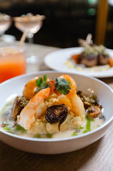 Grilled Jumbo Shrimp with Coconut Milk Risotto, Charred Brussel Sprouts, Lemongrass Butter Sauce, Roasted Pepitas and Lime
