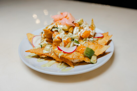 Lounge Salmon Nachos with Salmon Belly, Soy Ginger BBQ Sauce, Wasabi Aioli, Pickled Ginger, Cucumber, Avocado and Wonton Chips