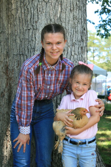 Peyton Henschel and Vera Brenton (age 5) and her Buff Brahma Bantam Chicken, Christmas. Photo Credit: Allyson Henschel. 