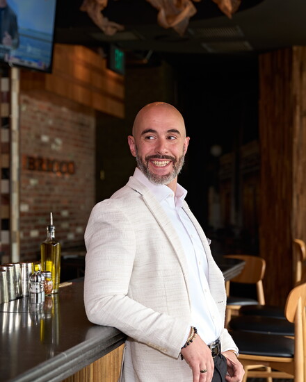 Adrian Costa, at the granite bar his company installed in Restaurant Bricco in West Hartford. Photo by John Helmke