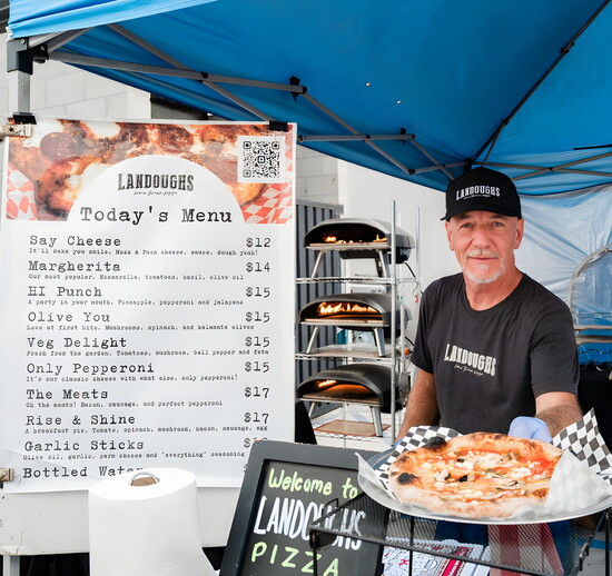 Kent Land serves up a taste of Landoughs at the local farmers’ market. Photo Credit: Johnny Lorenz