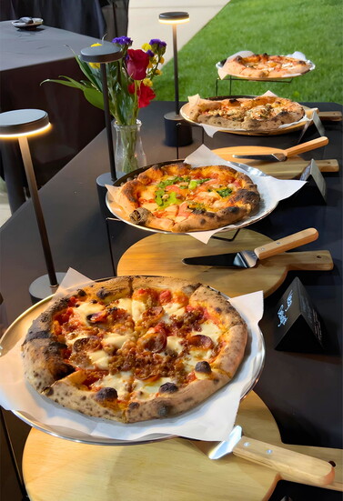 Landoughs pizzas ready to be served at a catered event. Photo Credit: Kent Land