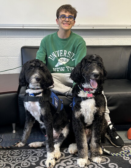 Student Cole Foster with Ernie and Maple.
