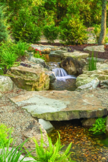 A 150’ pondless waterfall that snakes throughout a Japanese themed garden. The soft water flow and large boulders give it a look of being established for 1,000 