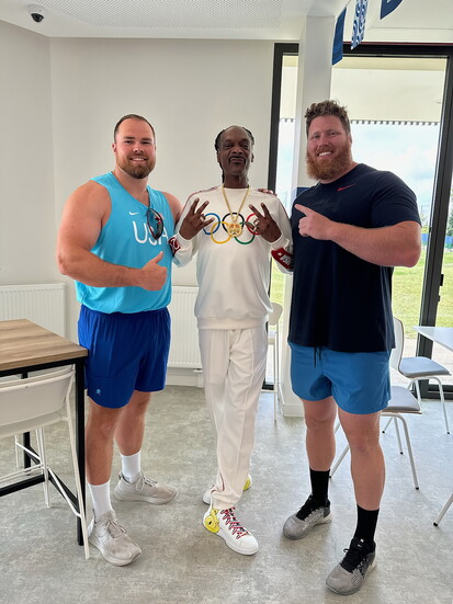 Otterdahl (left) and Crouser (right) with music icon Snoop Dogg. 