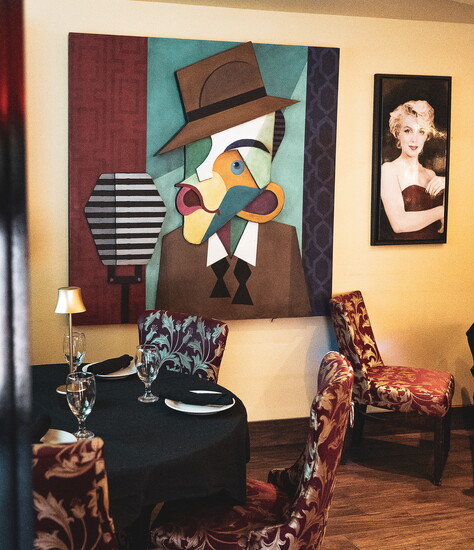 Eclectic artwork and intimate seating create Amore’s vibrant dining atmosphere.