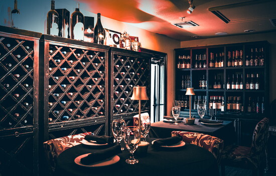 A curated wine collection enhances dining and conversation at Amore.