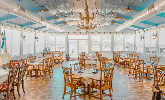 Lakeside sunroom offers natural light and beautiful views of Lake Conroe.