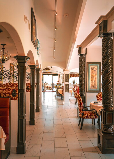Elegant arches and rich décor welcome guests into Amore’s inviting dining spaces.
