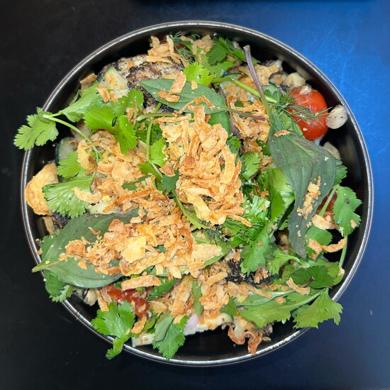 Union's Roasted Cauliflower bowl is served chilled, tossed in tamarind dressing with shallots, cucumbers, cherry tomatoes, fresh herbs and crispy onion.