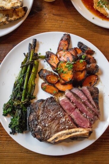 Dry Aged Kansas City Strip with Grilled Broccolini and Fire-Roasted Carrots at The Appalachian