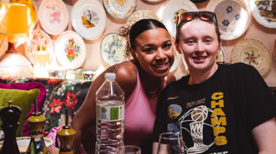 Oklahoma Sooners Women's Basketball guards Kelbie Washington and Taylor Robertson enjoy themselves at a cafe in France. (Photo by Johnny Smiley)