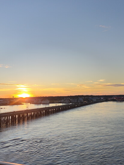 Sunset over the bay as seen from Cambia Hotel. Photo Credit: Trevor Joppich