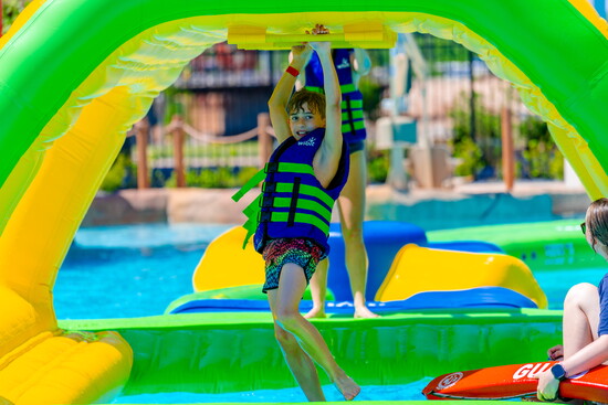 Kids splash, climb, slide, and explore endless adventures across Okana's exciting water attractions.