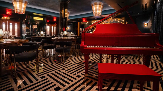 The Aria Room, named for Joseph Palladino’s daughter, offers an intimate setting anchored by its signature red piano.Courtesy of Palladino’s Steak & Seafood