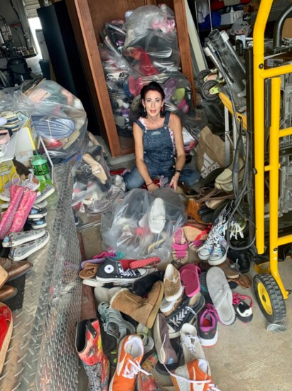 R'Achelle amongst shoes donated to benefit Damn Cancer