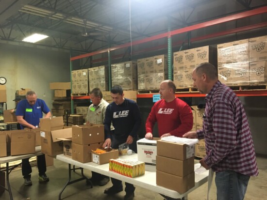 "Vans For Cans" community event where Lee Company technicians collect canned goods to be donated to Second Harvest Food Bank