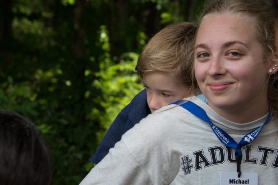 Annalise Bernardino and a young camper