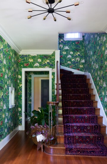 The entry foyer with Schumacher's Lotus Flower wallpaper.