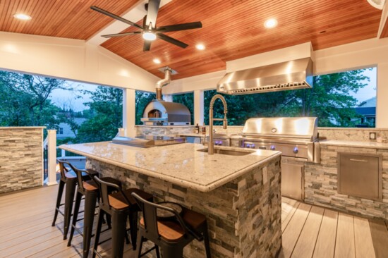 A full outdoor kitchen with pizza oven.