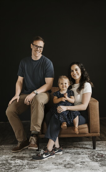 Andrew and Briheanna Boonstra pose with their daughter, Lillian, as ty celebrate bringing Art of Drawers to the Omaha metro.