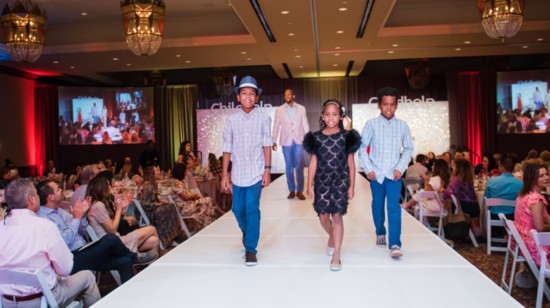 A family walking in the Childhelp Wings fashion show in a previous year. Photo courtesy Childhelp