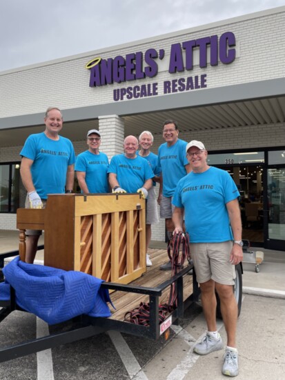 Angels’ Attic volunteer furniture movers Bill Crown, Jon Shannon, Bob McMillan, Donnie Church, Jim Johnson and Brad Wright prepare to deliver a piano