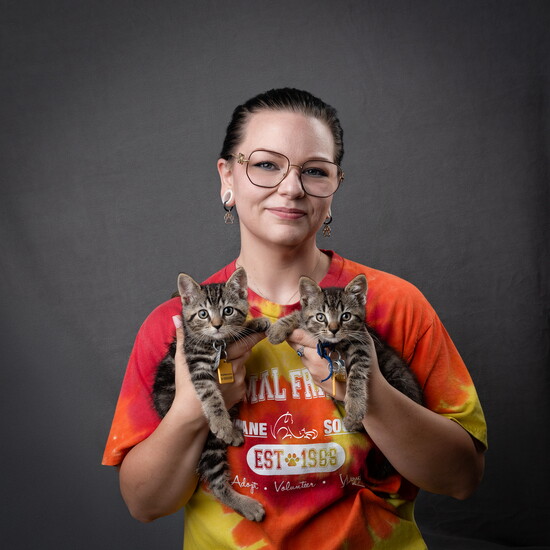Animal Friends Kennel Technician Natalie Botner with kitten siblings.