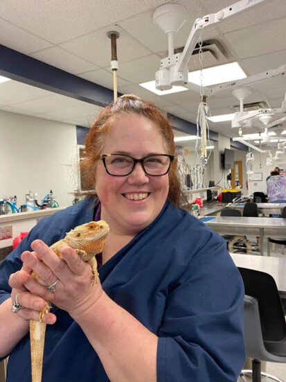 Kristen Hedeen shows off a bearded dragon.